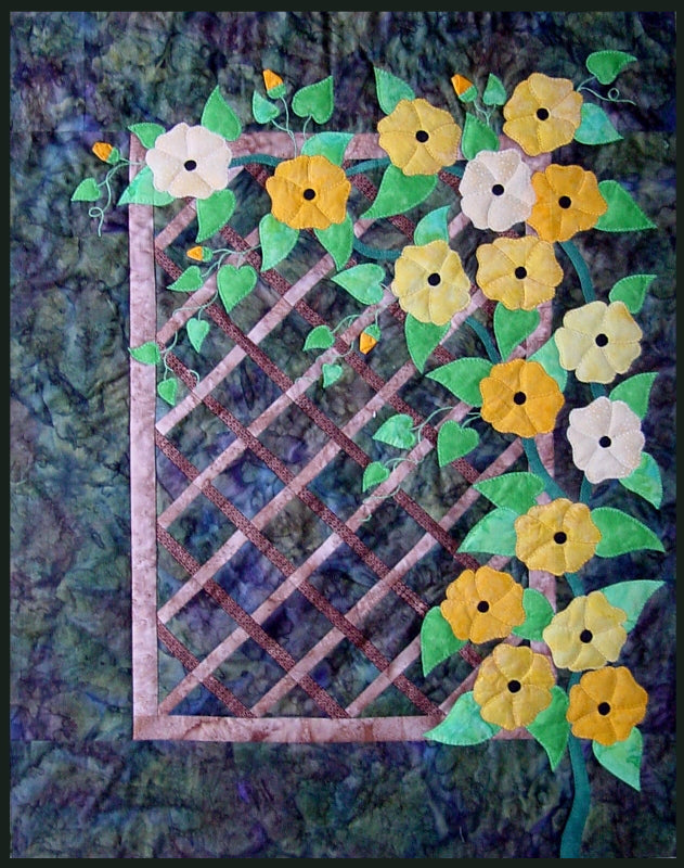 blooming trellis quilt has a patchworked trellis for the background with a flower vine appliqued over it - another patchwork applique quilt pattern in Ruth Blanchet colour wash collection