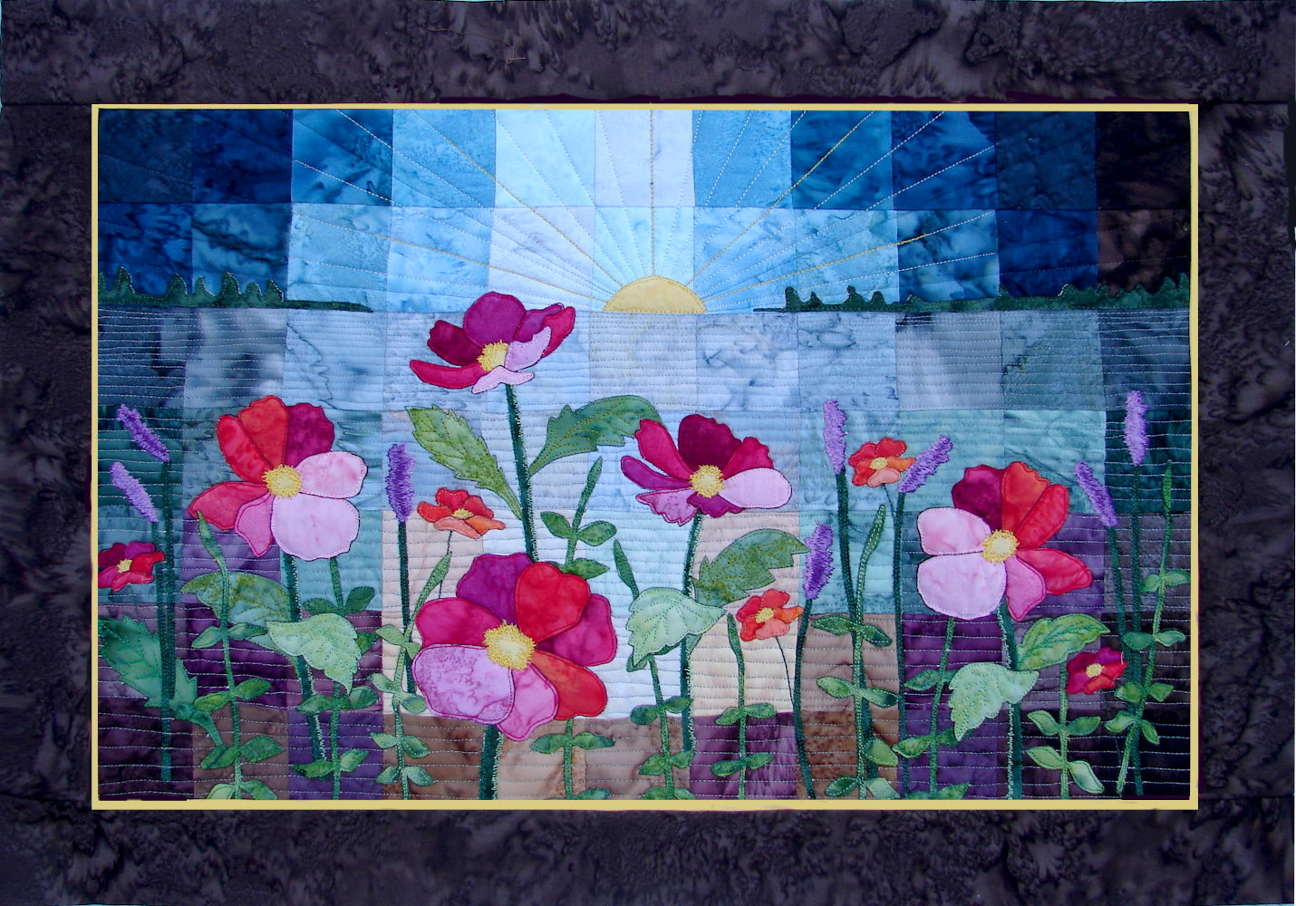applique wild flower quilt pattern with sunset or sunrise over a patchwork lake.