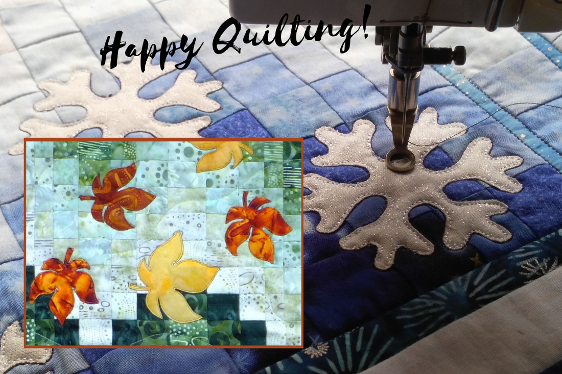 leaves and snowflakes appliqued and quilted on a bargello quilt