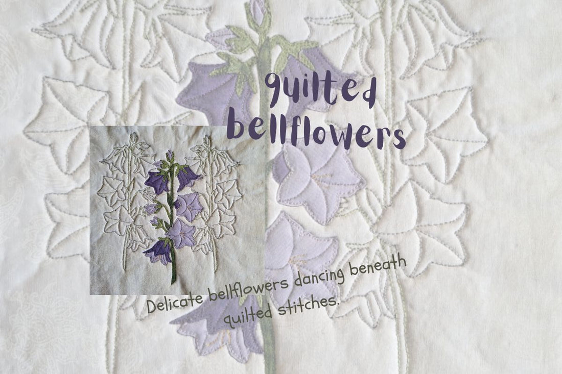 Close-up of quilted bellflowers with delicate stitching and softly textured background fabric.