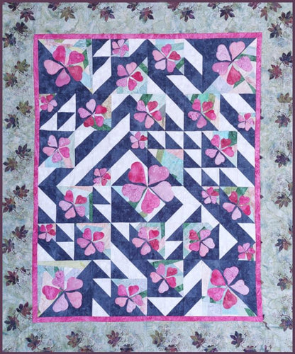 Ginkgo Garden quilt pattern where each block features half-square triangles, designed and positioned to form a leaf-whisking wind swirl.