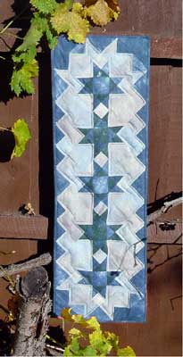 Blue star table runner made with hand dyed fabrics