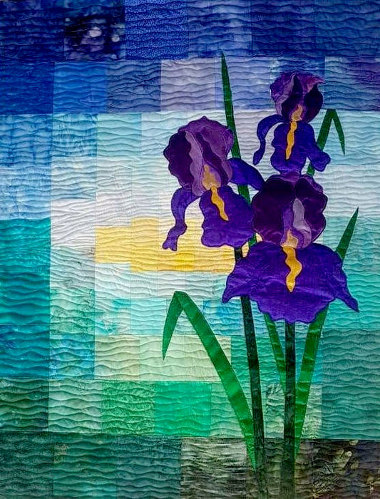 applique iris on a background of patchwork squares - quilt pattern