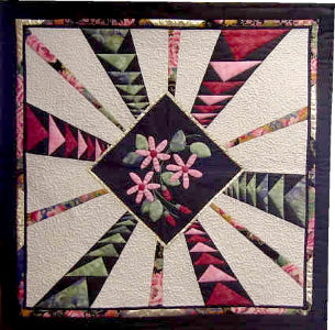 In a Distance - quilt made by Ruth Blanchet with clematis flower and dimensional flying geese