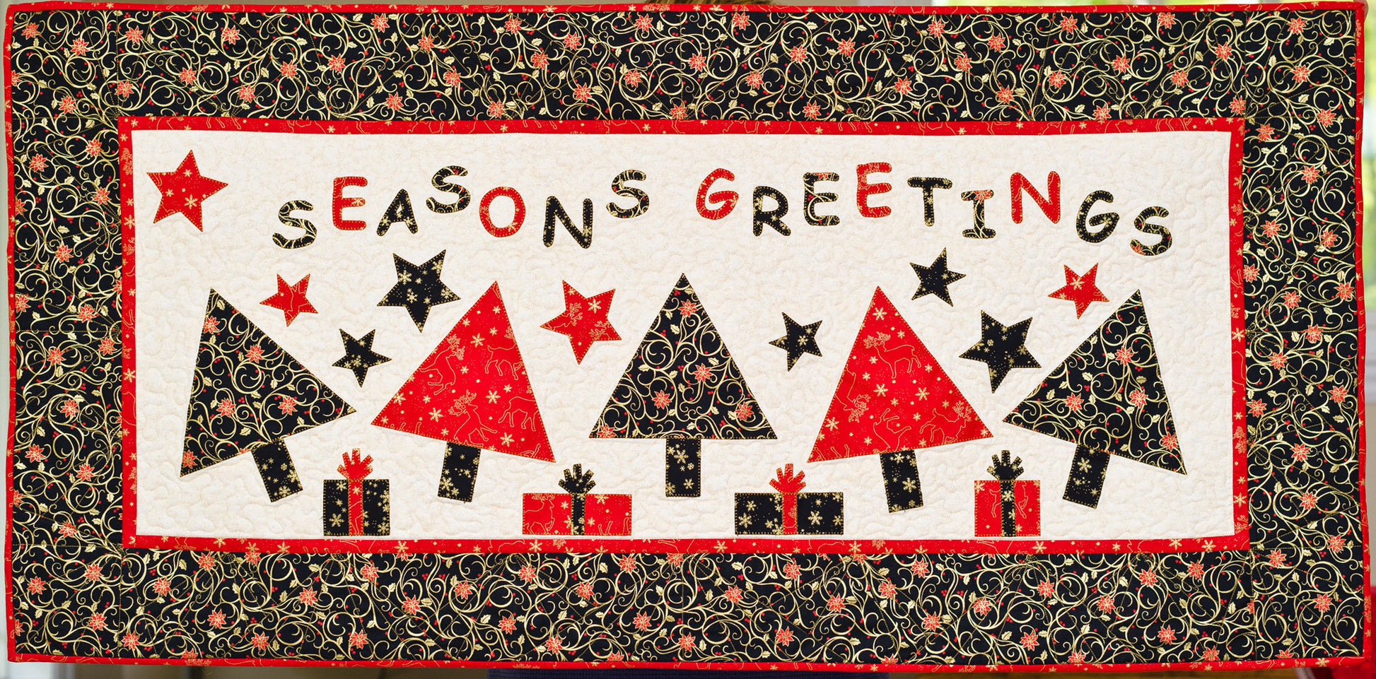 Black and red Seasons greetings quilted wall banner quilt pattern by Jennifer Houlden