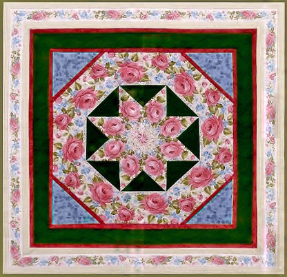 a quilt pattern by Anita Eaton featuring a star medallion in the center and a rose border print