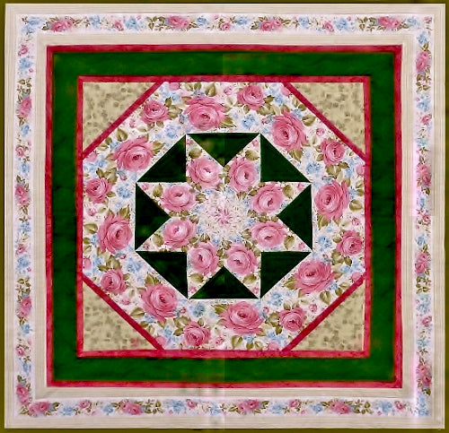 a quilt pattern by Anita Eaton featuring a star medallion in the center and a rose border print