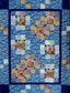 Stepping Stones is a patchwork quilt pattern designed by Ruth Blanchet and made using printed patches.