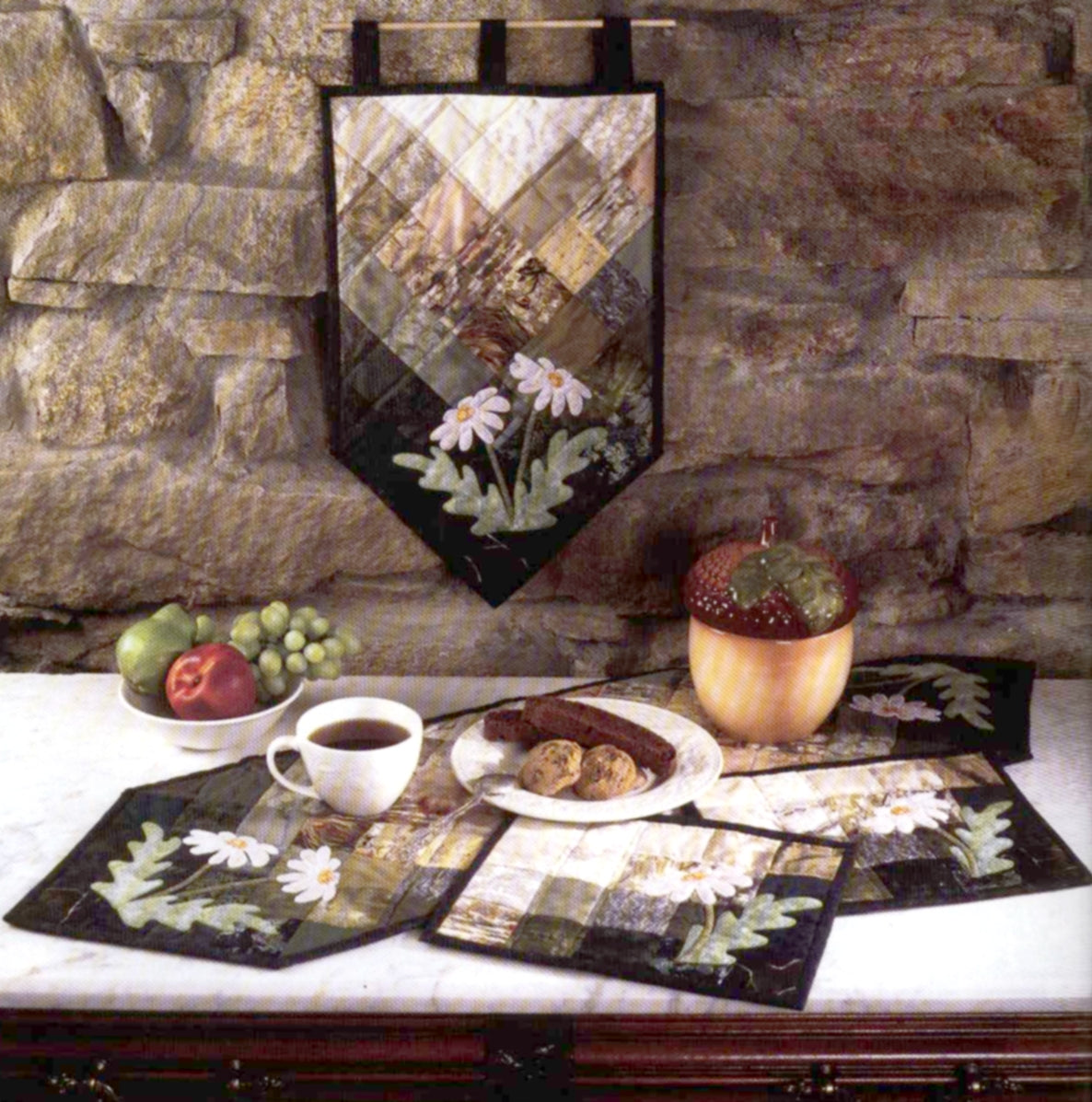 patchwork and applique table runner, placemats and wall hanging quilt pattern for fall. Includes a simple applique daisy design