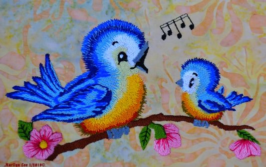 blue birds singing on a branch embroidery design