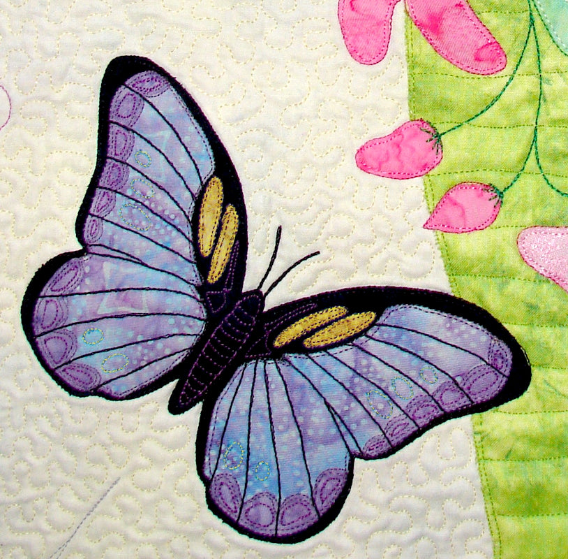 Close up of appliqued purple butterfly with yellow option of Ruth Blanchet's Spring Life quilt pattern