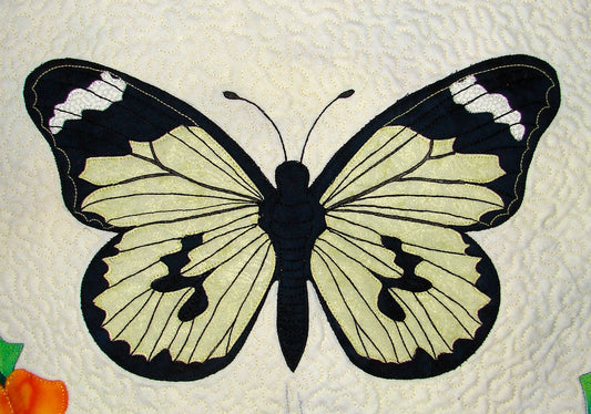 Single applique block pattern of yellow butterfly from Ruth Blanchet's Spring Life quilt pattern