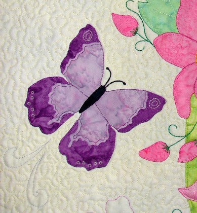 small purple butterfly appliqued on the Spring Life quilt pattern by Ruth Blanchet, Arbee Designs