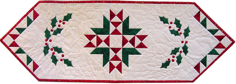 Christmas table runner quilt pattern with pieced center and holly leaves