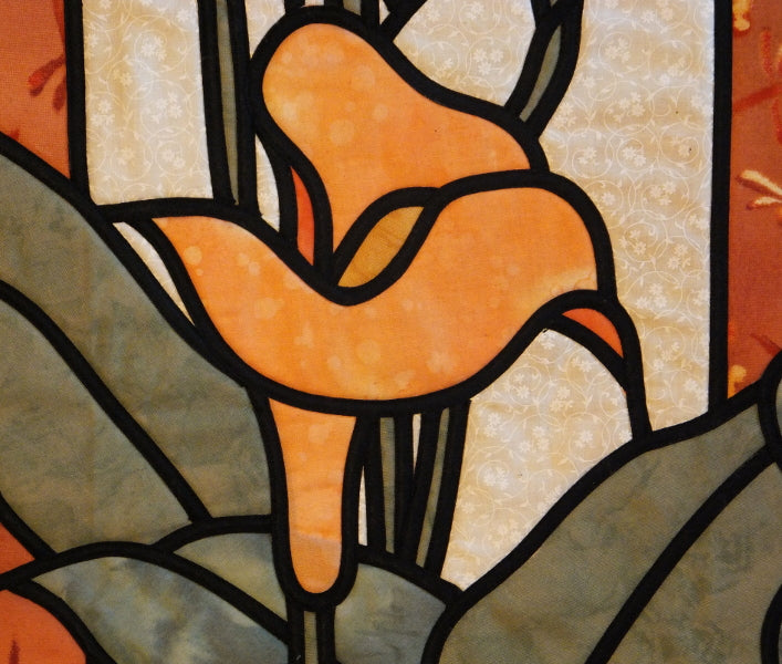 Close up of stained glass calla lily quilt pattern