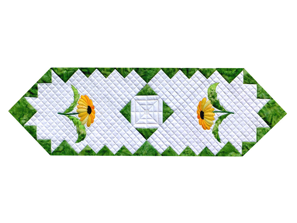 daisy applique on a patchwork table runner quilt pattern