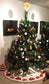 christmas tree skirt quilt pattern with poinsettias and snowflakes