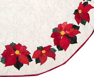 close up of christmas tree skirt quilt pattern with poinsettias and snowflakes