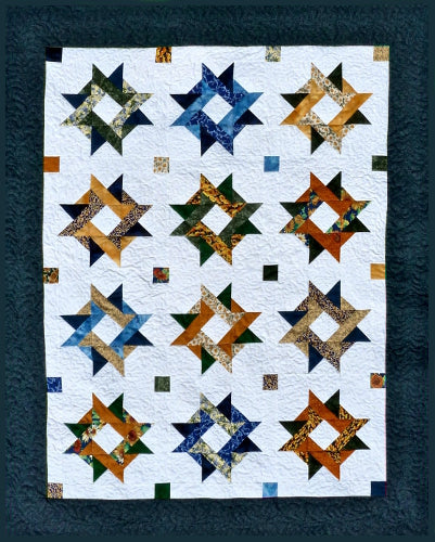 Blue starry patchwork quilt is truly patchwork when made as a scrappy quilt. quilt pattern available