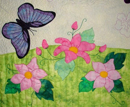 applique clematis flowers and leaves with blue butterfly from the border of Spring Life quilt pattern by Arbee Designs
