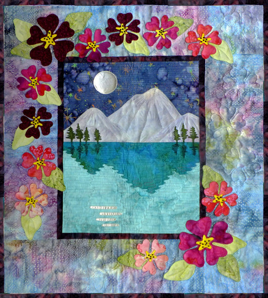 Moon lake quilt pattern with shimmering water and moon reflection under mountains and a hibiscus flower border - full instructions and templates included in this applique quilt pattern
