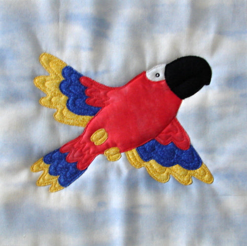 animal quilt block of a parrot designed for an animal quilt