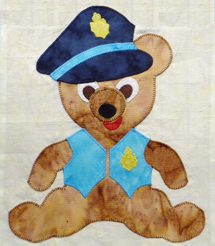 applique block quilt design of Teddy bear dressed in a policeman's costume