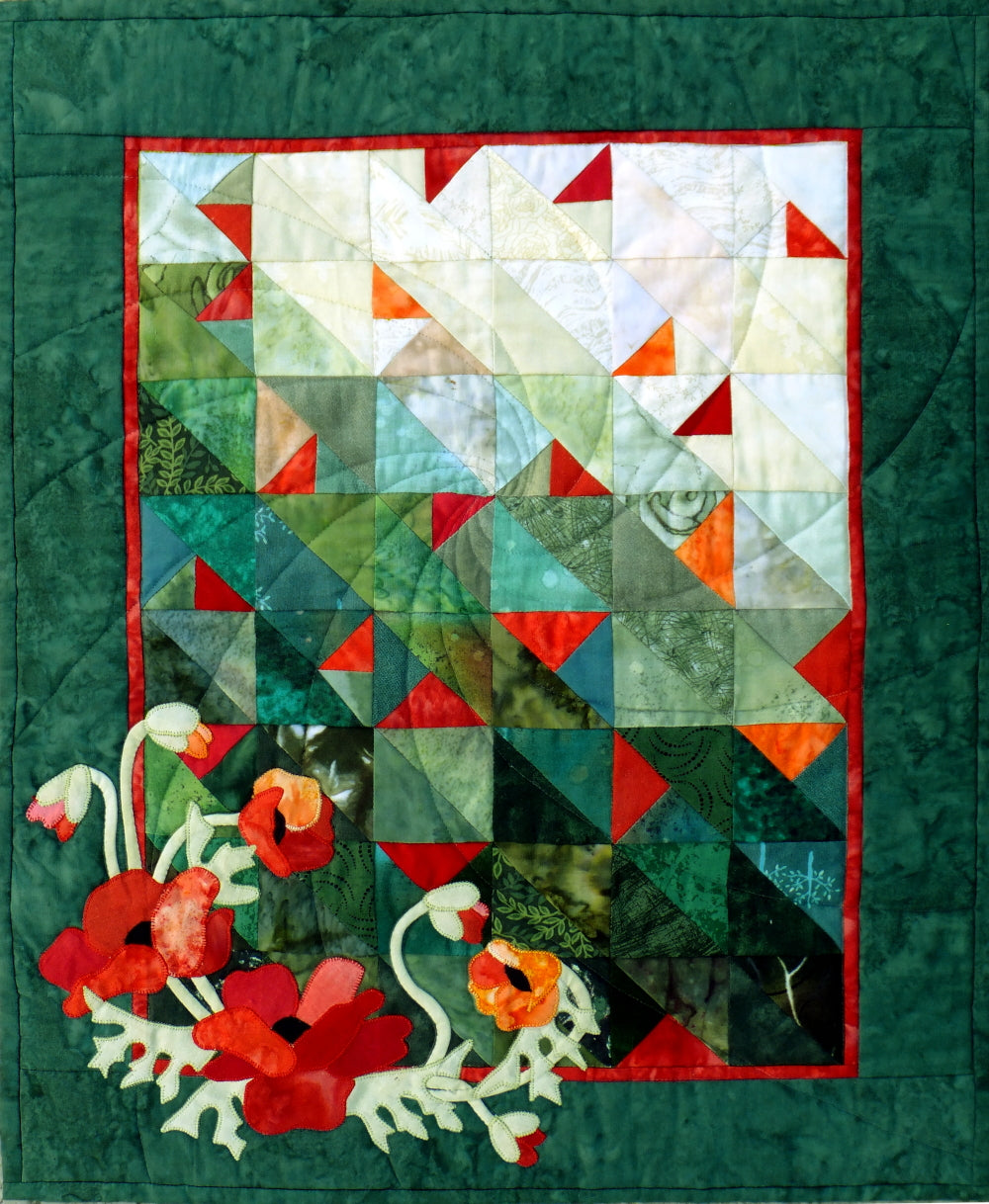 applique poppies quilt pattern by using lots of scraps. This quilt pattern has a color wash background with poppies appliqued on top