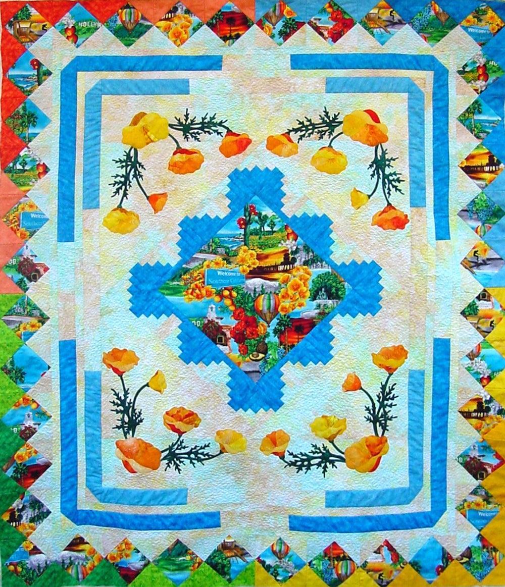 scenic quilt pattern with applique poppies, log cabin blocks and square in a square block using a colorful print fabric