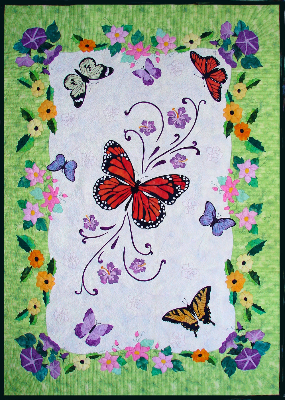 Spring Life quilt pattern with appliqued butterflies and flowers