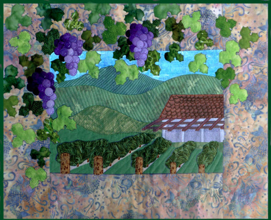 The vineyard is a quilt pattern depicting a grape vine around the border over a vineyard as the scene