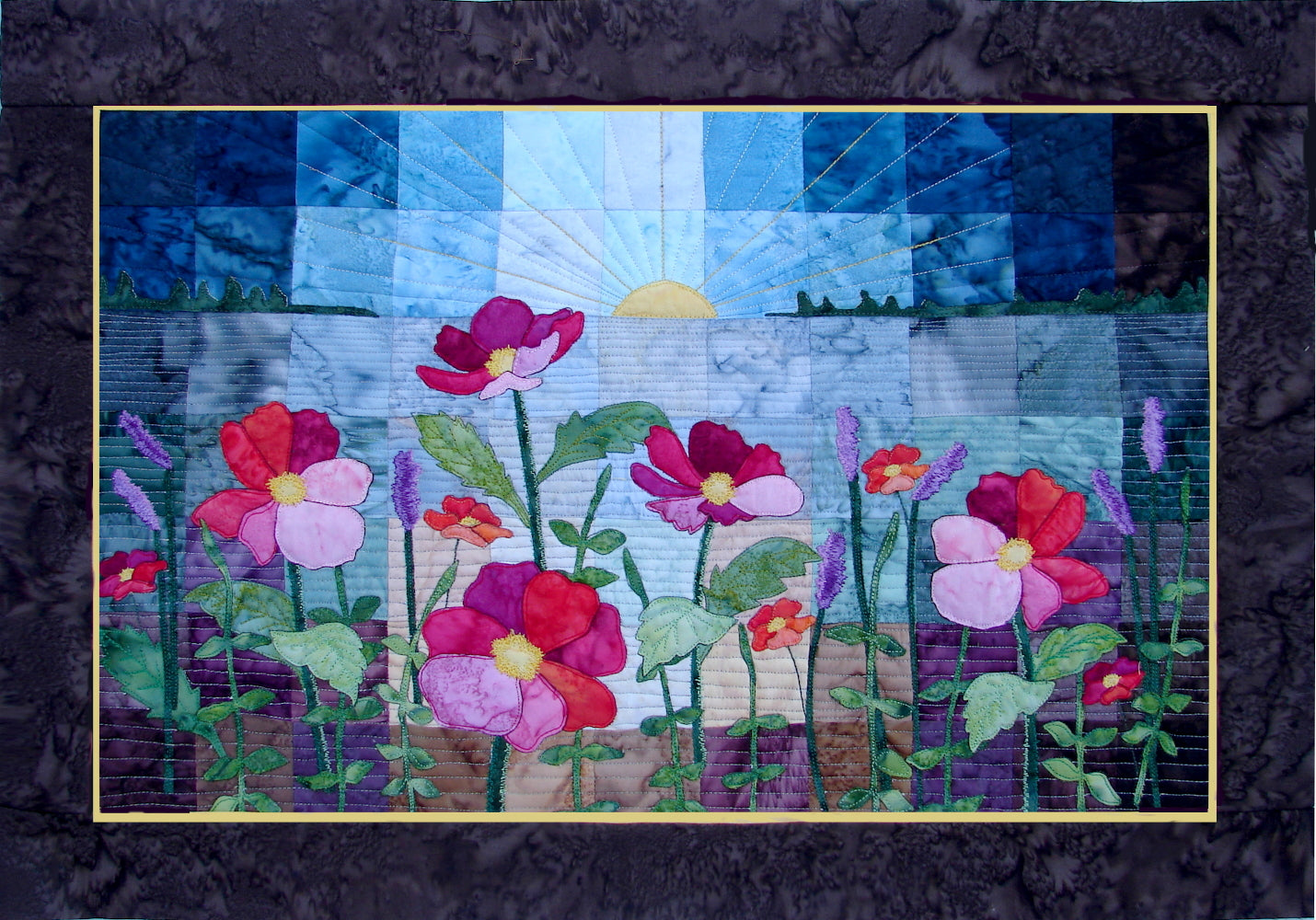 applique wild flower quilt pattern with sunset or sunrise over a patchwork lake. 