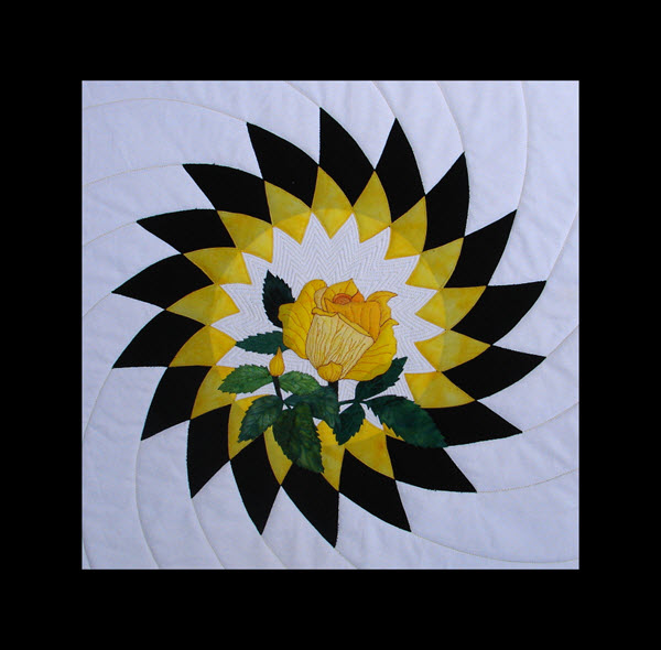 Yellow rose of hope quilt pattern with applique rose on applique background
